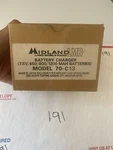 New Old Stock Midland Mobile Radio Battery Charger 70-C13 Unused Open. Price: $59.00.